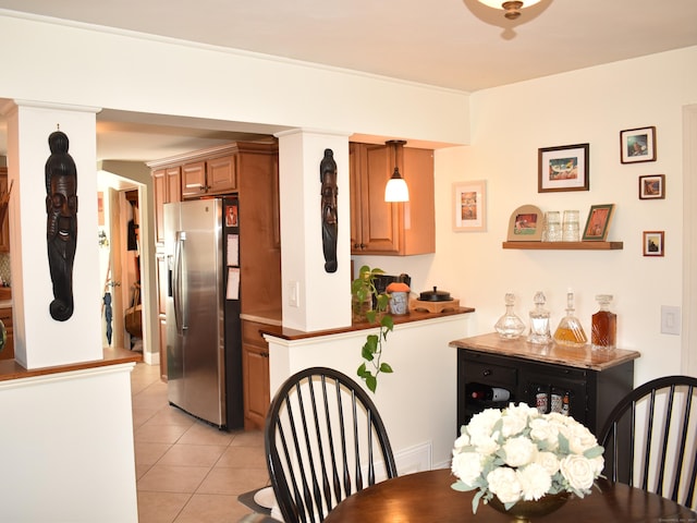 dining area with light tile patterned flooring