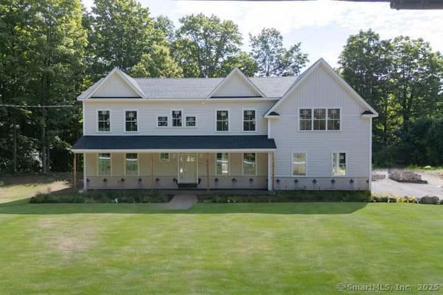 view of front facade featuring a porch and a front lawn