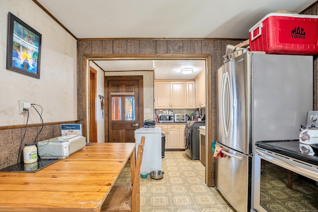 kitchen with washer / clothes dryer, ornamental molding, stove, and butcher block countertops