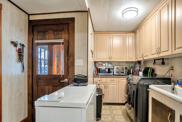 laundry room featuring cabinets and washing machine and dryer