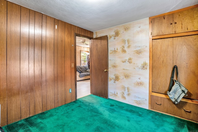 unfurnished room featuring a textured ceiling