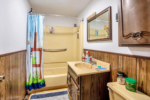 full bathroom featuring vanity, shower / tub combo with curtain, wooden walls, and toilet