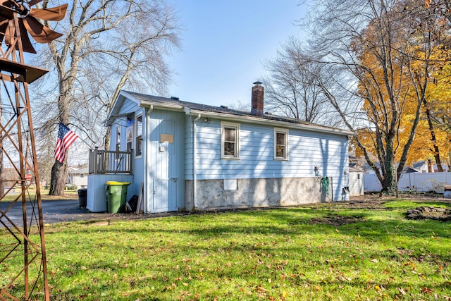 view of home's exterior with a lawn