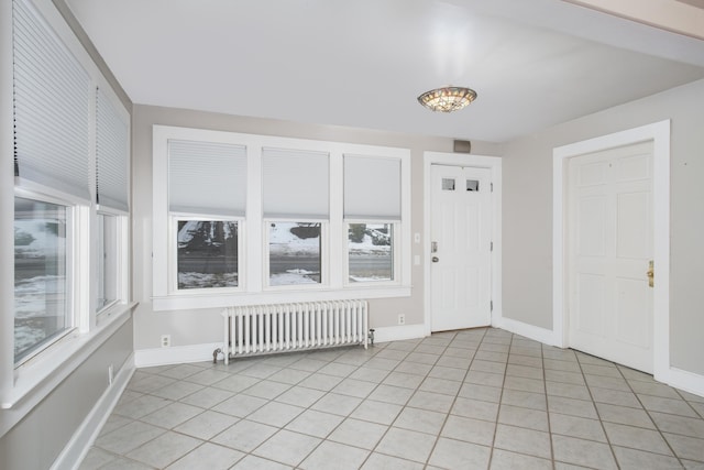 tiled foyer entrance with radiator