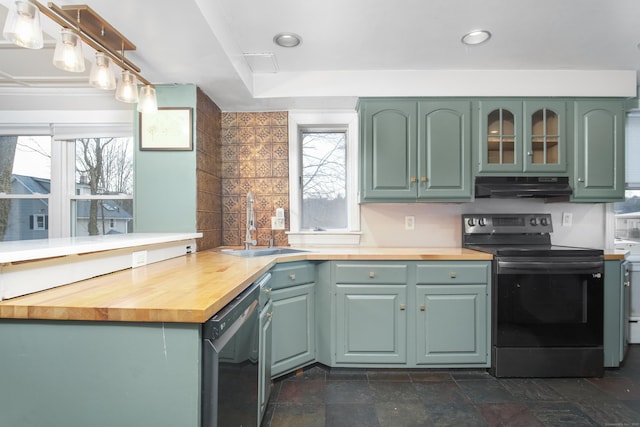 kitchen featuring sink, green cabinetry, wooden counters, range with electric stovetop, and dishwashing machine