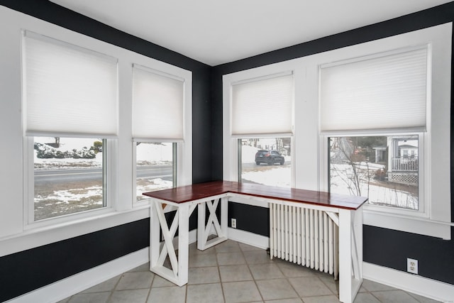 tiled office space with radiator heating unit