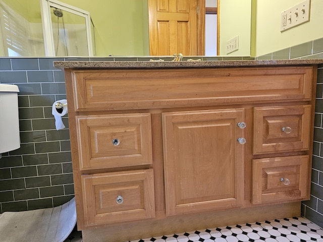 bathroom with vanity and tile walls