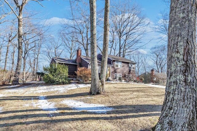 view of front of home with a yard