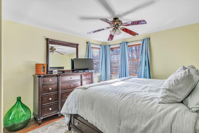 bedroom featuring dark wood-type flooring and ceiling fan