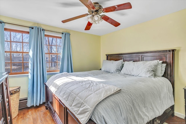 bedroom featuring ceiling fan and light wood-type flooring