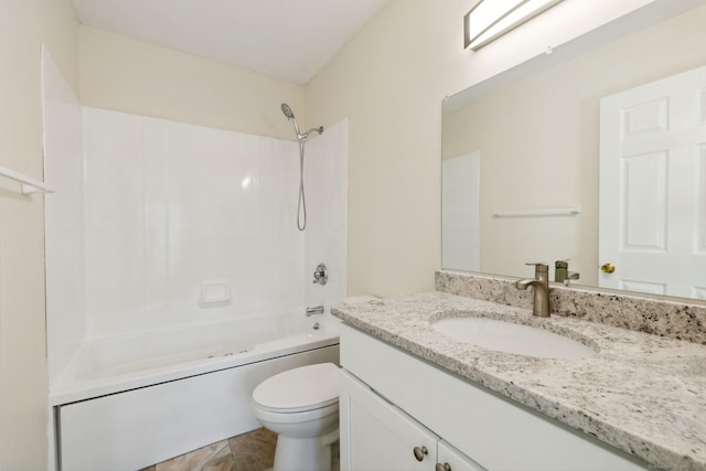 full bathroom with bathtub / shower combination, vanity, and toilet