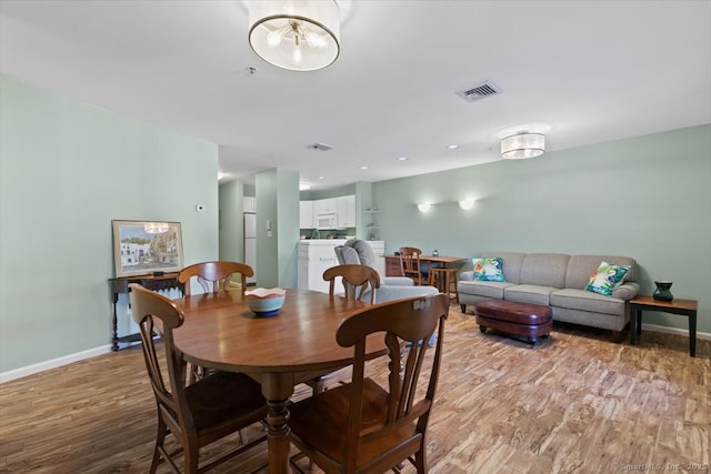 dining room featuring light hardwood / wood-style flooring