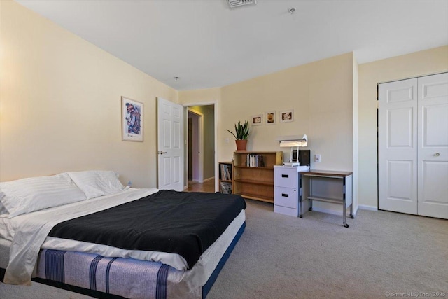 bedroom with carpet floors and a closet