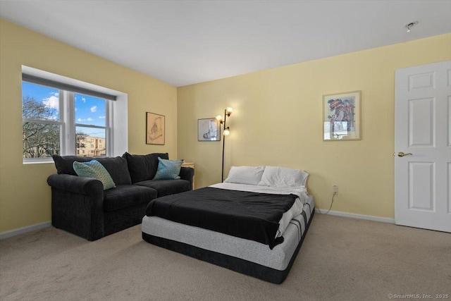 bedroom with light colored carpet