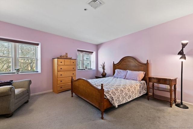 bedroom featuring light colored carpet