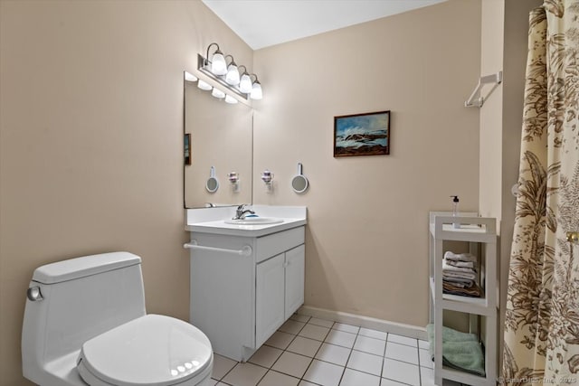 bathroom featuring tile patterned floors, vanity, and toilet