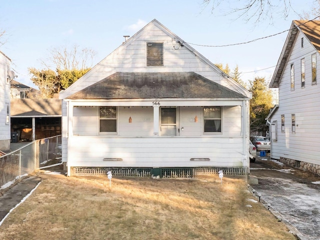 back of house featuring a yard