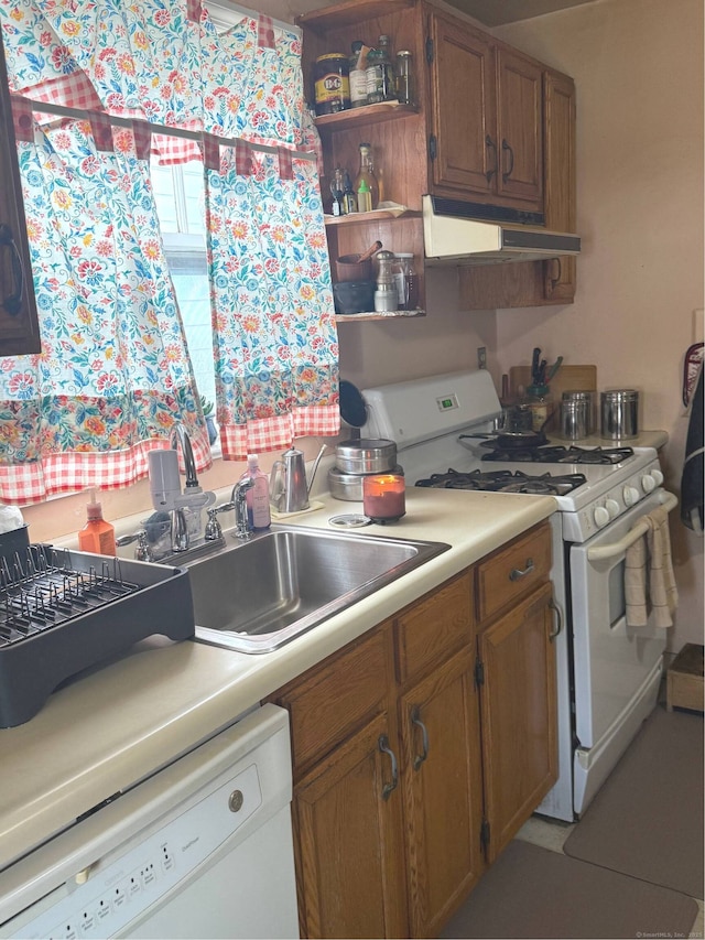 kitchen featuring sink and white appliances