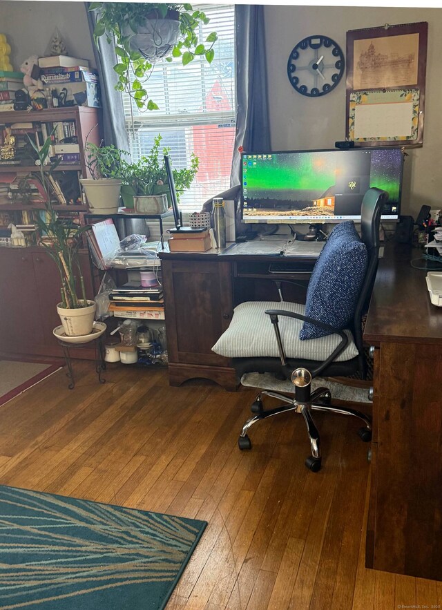 office space with hardwood / wood-style flooring