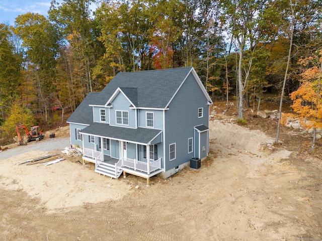 view of front of property featuring central AC and covered porch