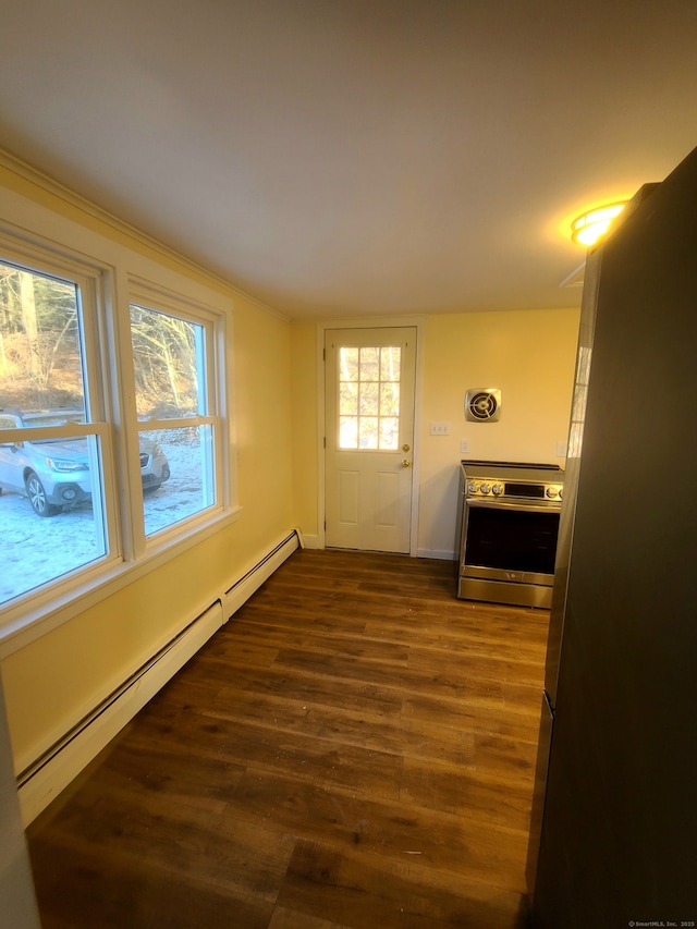 entryway featuring a baseboard heating unit, dark wood-style flooring, and baseboards