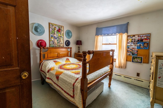 carpeted bedroom featuring a baseboard radiator