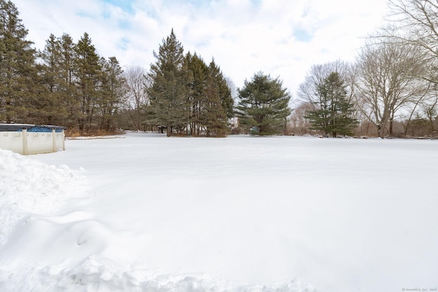 view of yard layered in snow