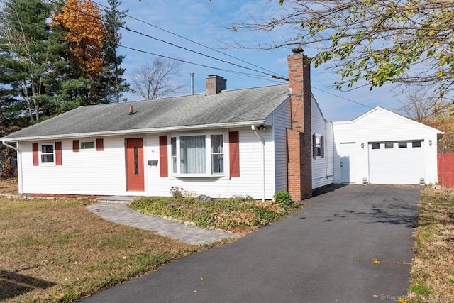 view of front of house with a garage and a front lawn