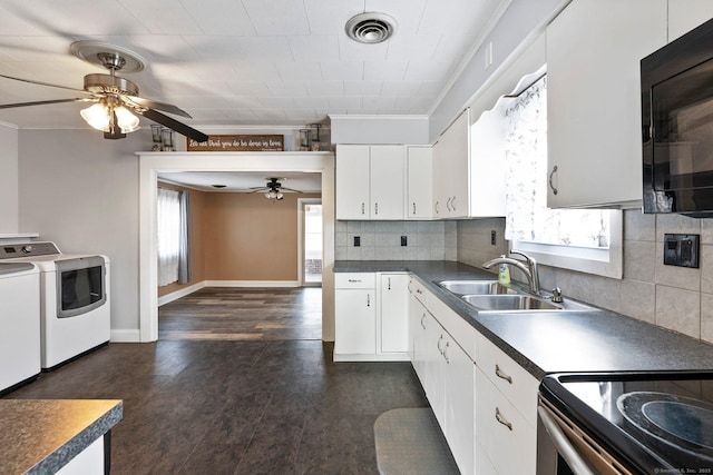 kitchen with tasteful backsplash, white cabinetry, sink, dark hardwood / wood-style flooring, and ornamental molding