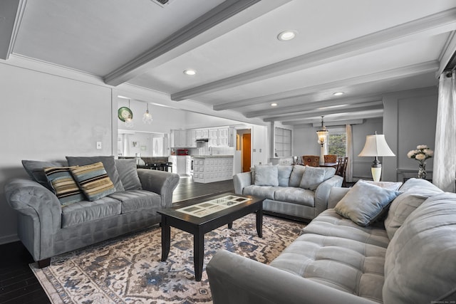 living room with hardwood / wood-style floors and beamed ceiling