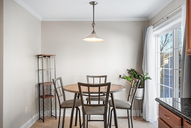 tiled dining area with crown molding