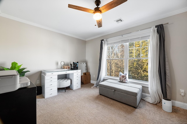 carpeted office with crown molding, plenty of natural light, and ceiling fan