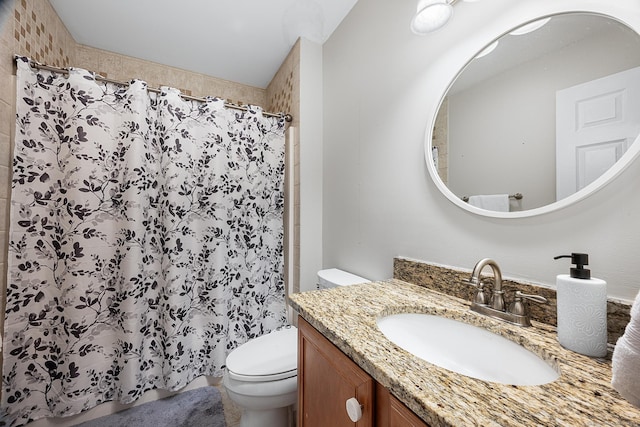 bathroom featuring vanity, toilet, and a shower with shower curtain