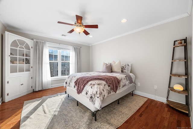 bedroom with crown molding, ceiling fan, and hardwood / wood-style floors