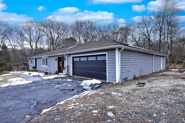 single story home featuring a garage