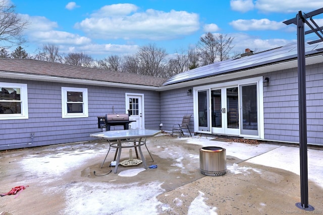 view of patio with a grill and french doors