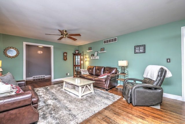 living room with ceiling fan and dark hardwood / wood-style floors