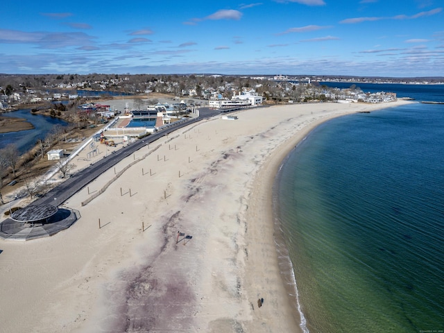 bird's eye view featuring a view of the beach and a water view