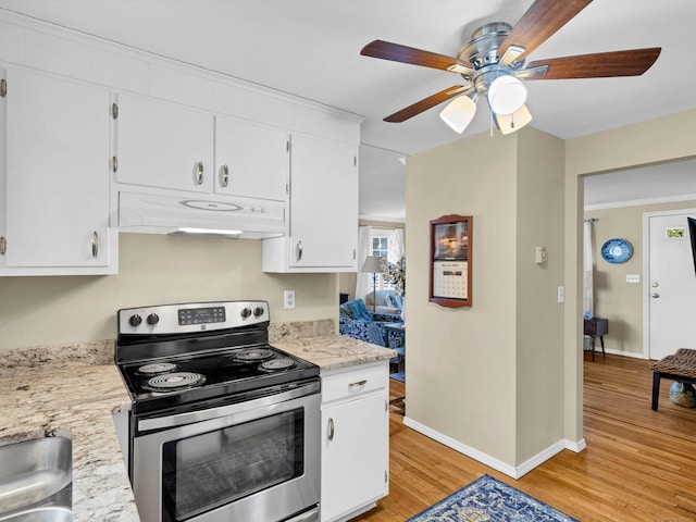 kitchen with under cabinet range hood, light wood-type flooring, stainless steel electric range, and white cabinetry