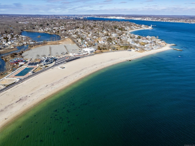 bird's eye view with a beach view and a water view