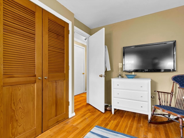 bedroom featuring a closet and light wood finished floors