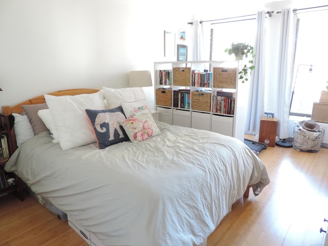 bedroom with light wood-type flooring