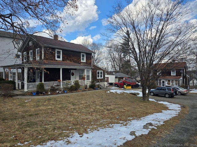 exterior space with a yard and covered porch