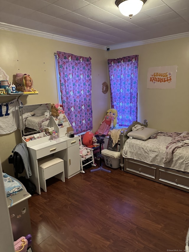 bedroom featuring dark wood-type flooring and ornamental molding