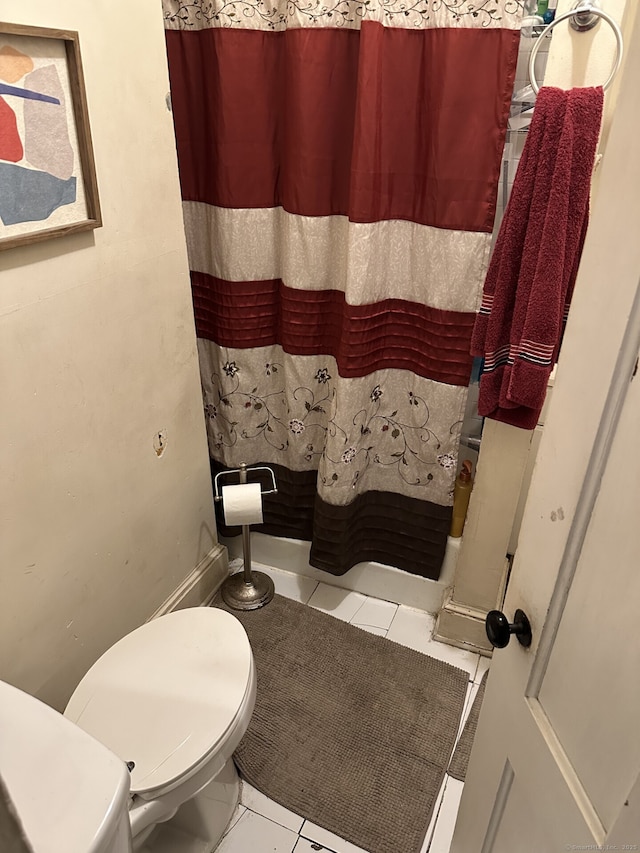 bathroom with tile patterned floors and toilet