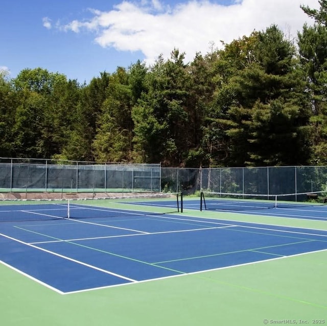view of sport court with community basketball court and fence