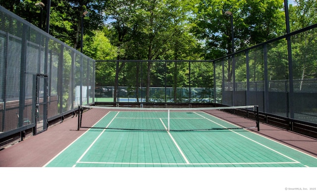view of sport court featuring fence and community basketball court
