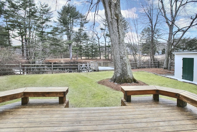 exterior space with a fenced backyard, a yard, and an outdoor structure