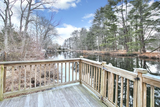 wooden terrace with a water view