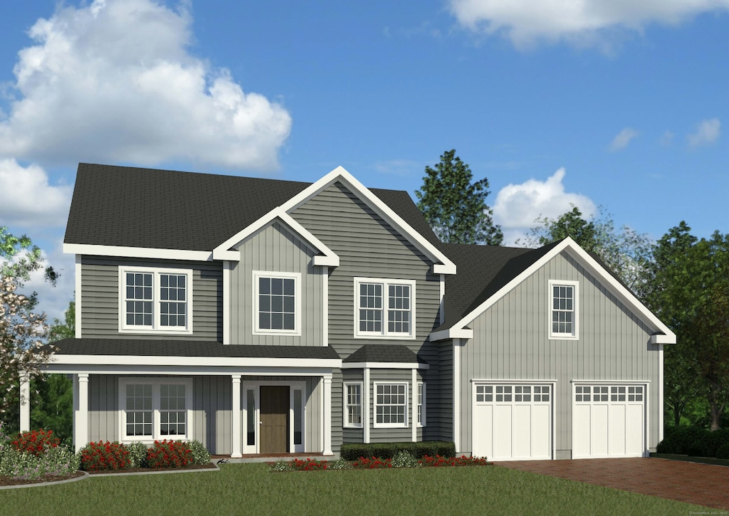 view of front of house featuring a garage and a front yard